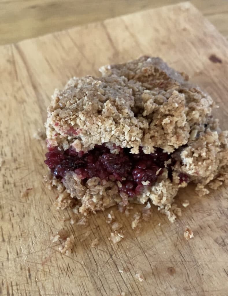 Flapjack bars with a layer of blackberries in the middle