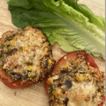 Peppers stuffed wtih quinoa and vegetables topped with cheese